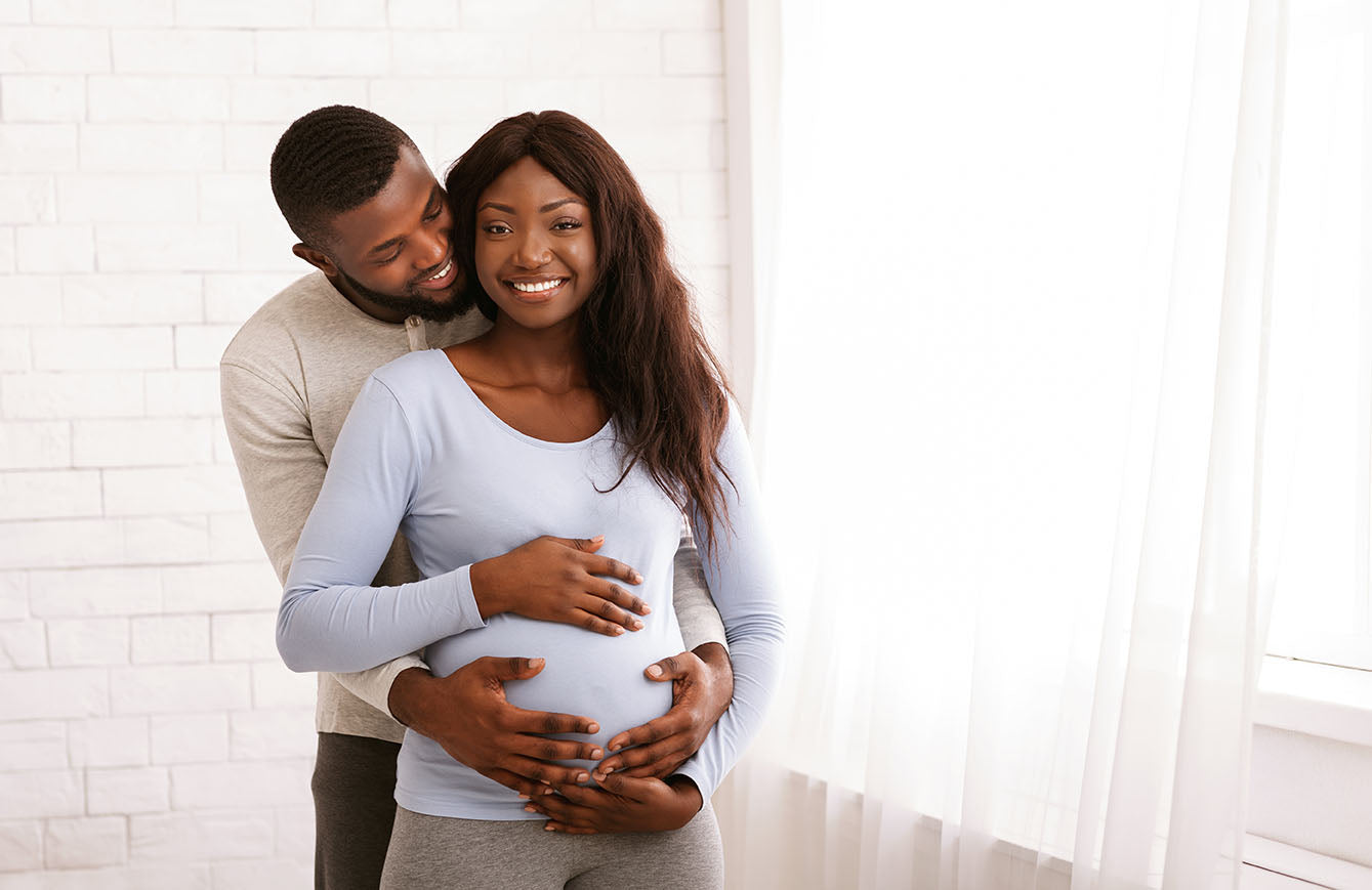Folic Acid vs Folate During Pregnancy. Young, happy man and pregnant woman. Why is folate important?