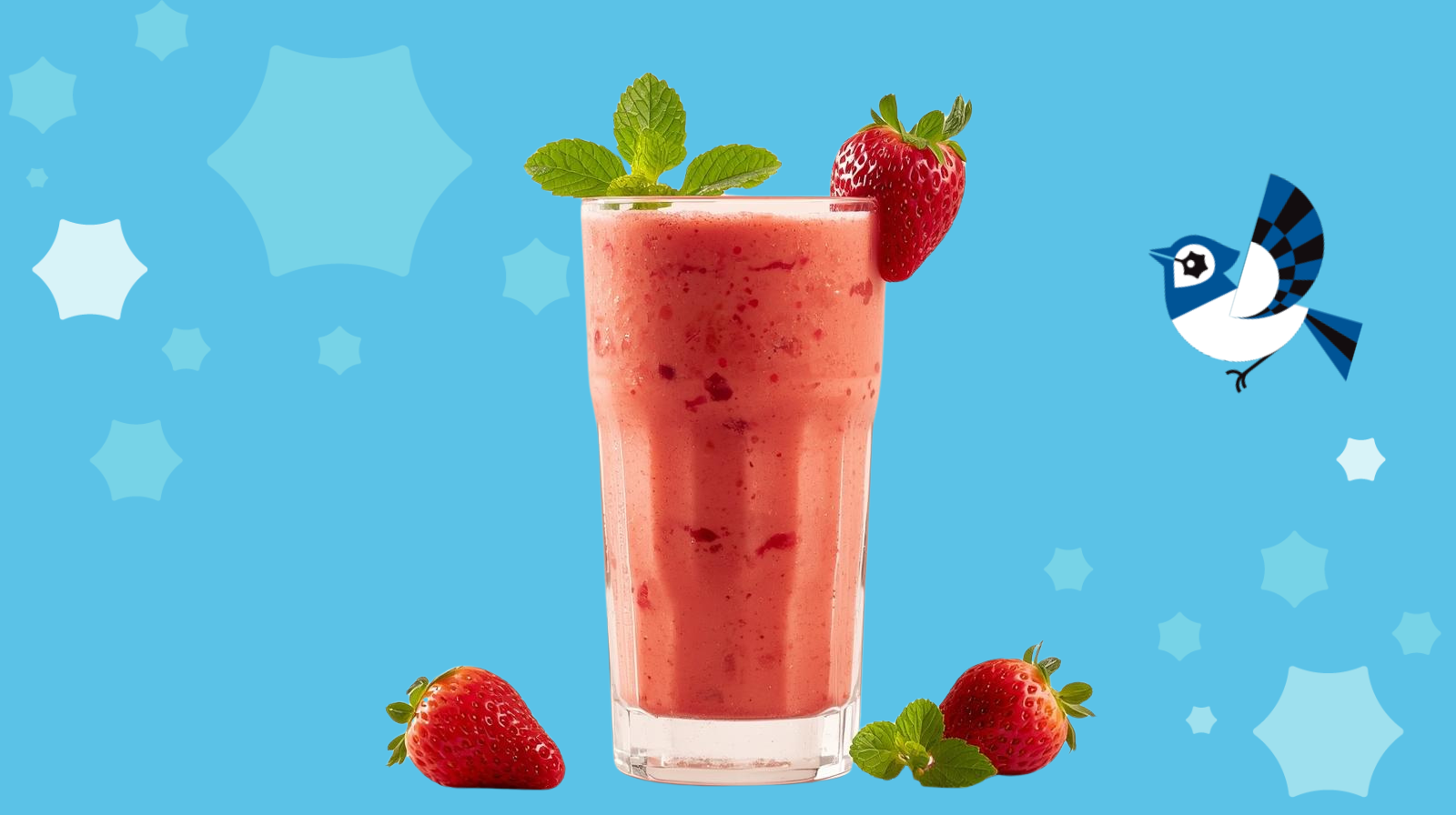 Super Strawberry Brain-Boost Smoothie with strawberries on the side and on the top of the glass